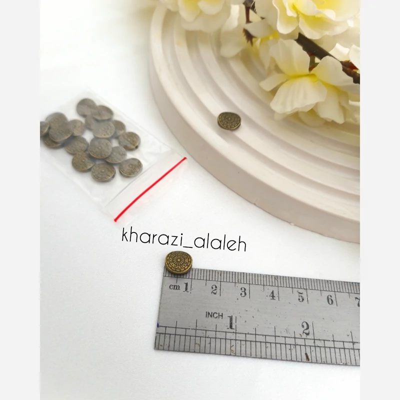 خرجکار بین مهره طرح دکمه (فروش به صورت بسته 15 گرمی و تعداد تقریباً 20 عدد )