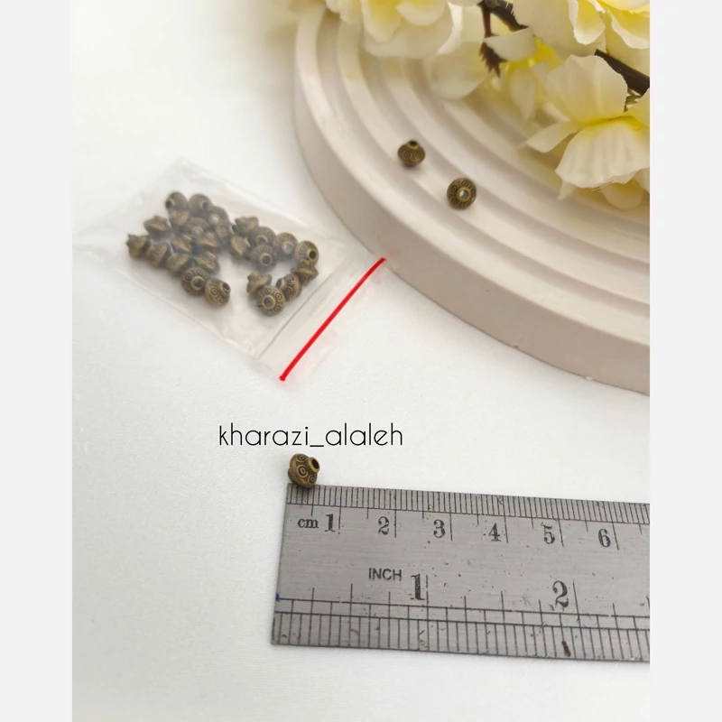 خرجکار بین مهره طرح فرفره (فروش به صورت بسته 15 گرمی و تعداد تقریباً 28 عدد )