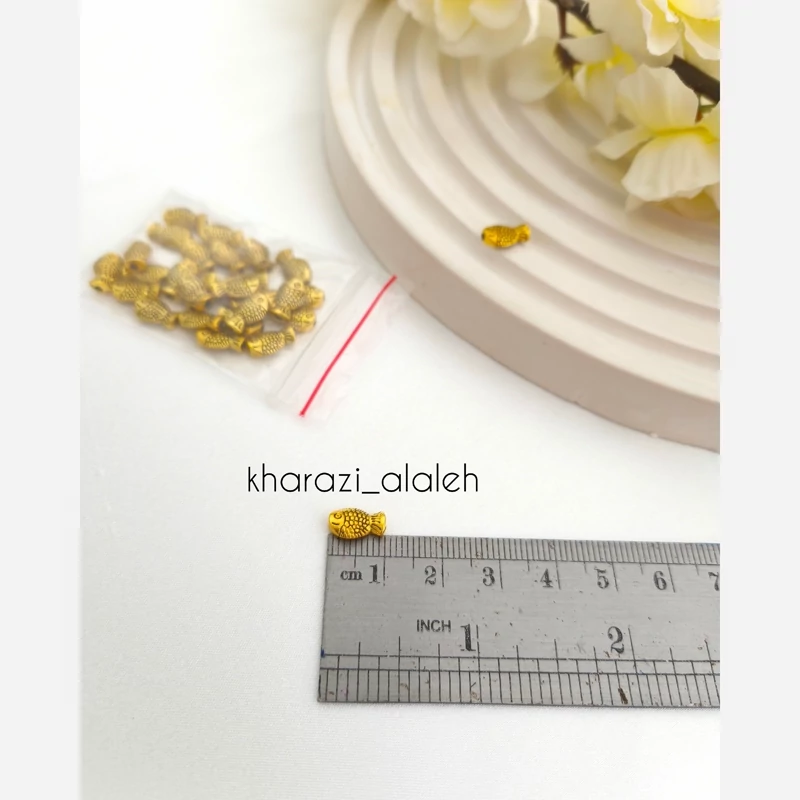 خرجکار بین مهره طرح ماهی (فروش به صورت بسته 15 گرمی و تعداد تقریباً 28 عدد )