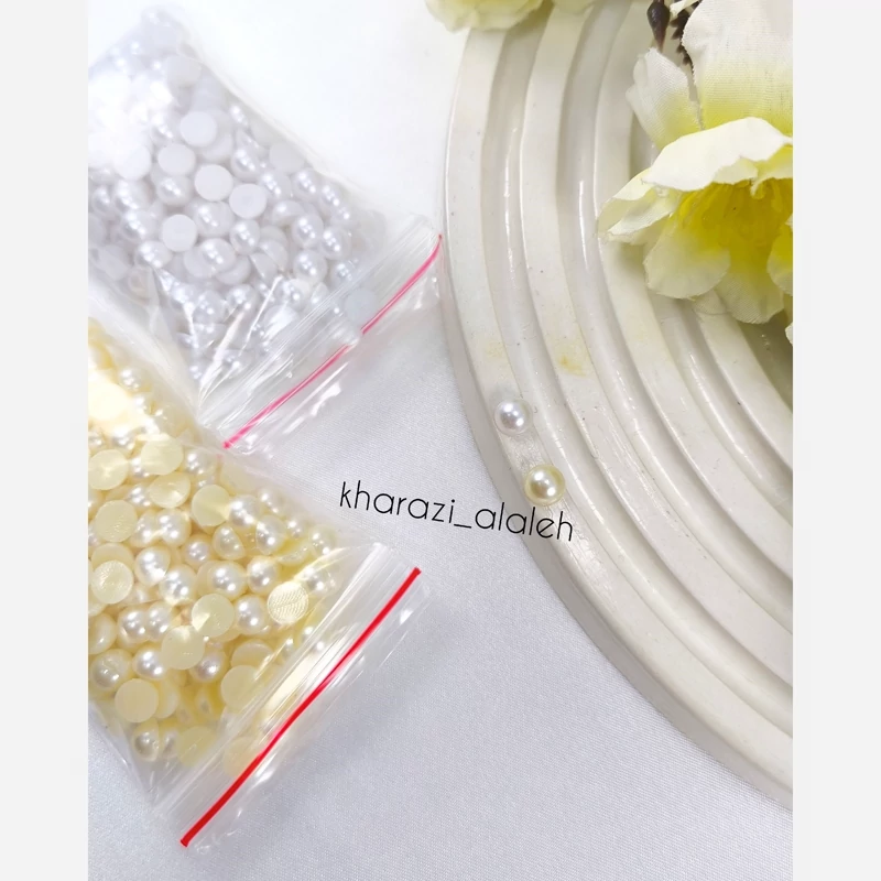 مروارید لپه ای سایز 06 (فروش به صورت بسته 20 گرمی)(سفید حدوداً 330 عدد و شیری حدوداً 280 عدد)